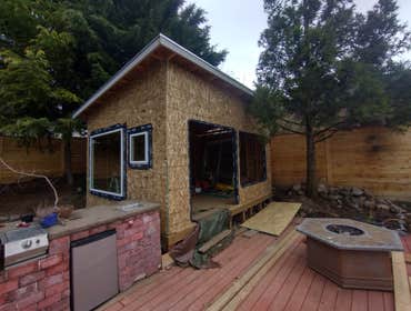 Photos by Stewart & Son Gate & Fence LLC #1 Tiny House with pergola. Small house 17' by 12' small bathroom with pocket door, and small sink with water 
