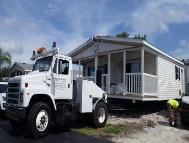 Photos by Blanchard's Mobile Home Removals and Transport Inc #1 New Clayton 16' X 76' Single wide Manufactured Home Spread Base Pad For Home, position 