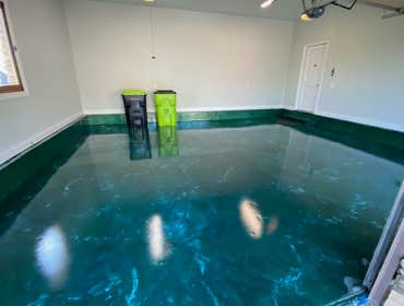 Sea of green garage floor Upper and lower level garage floors
500 sqft each
Forest green metallic epoxy floor with whit and gold highlights, marble pat