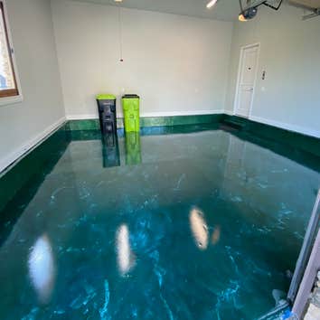 Sea of green garage floor Upper and lower level garage floors
500 sqft each
Forest green metallic epoxy floor with whit and gold highlights, marble pat