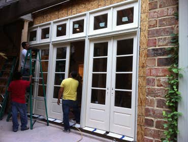 Custom Wall Unit Replacement Conversion of Wall to Triple set of French Doors and Transom Windows.