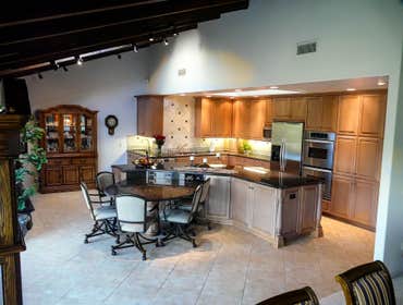 2004: Great Room Entertainment Kitchen The main criteria in this homes remodel was to remove a large wall separating the kitchen from the Formal Dining