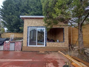 Photos by Stewart & Son Gate & Fence LLC #1 Tiny House with pergola. Small house 17' by 12' small bathroom with pocket door, and small sink with water 