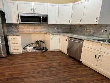 Photos by Tropical Building & Remodeling Inc #1 Completely removed old kitchen and end pony wall. Cut down pony wall to cabinet height and installed ro