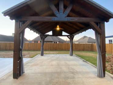 Photos by Dupont Technical Services #1 Kazeebo power. W fan added, motorized TV ceiling mount w 5 receptacles. And recess outdoor lighting.
