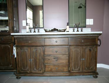 Walk-In Shower and double vanity Removed large soaking tub and small enclosed shower and replaced it with a large walk-in shower and freestanding soaki