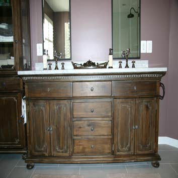 Walk-In Shower and double vanity Removed large soaking tub and small enclosed shower and replaced it with a large walk-in shower and freestanding soaki