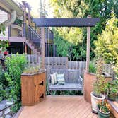 Project photos from Jbs Art Decko Trex deck with planters and swing.