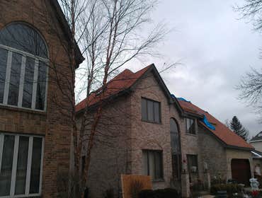 Project photos from Genesis Property Restoration Inc. Roofing, gutter work, siding, window replacement