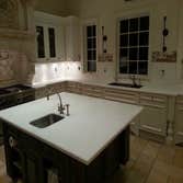 MARBLE WORK IN MIKE AND ALICIA PIAZA HOUSE Marble kitchen costume fabrication and installation.