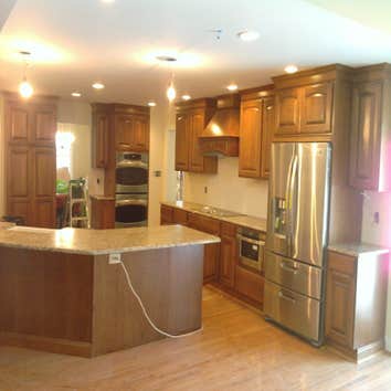 Quality Building And Restoration Llc Project Addition,Roof,Kitchen,Garage.Siding,Hardwood flooring,Added new bathroom, Custom made entertainment center