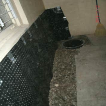Foundation Waterproofing Inside Pictures show the process of installing a waterproofing membrane, drainage, sump pump pit and new concrete in the basem