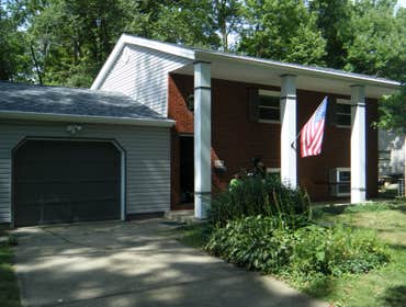 Rental property rehab Complete renovation including roofing, siding, windows, doors, kitchen, bathrooms, tile, hardwood flooring, trim work, and painti
