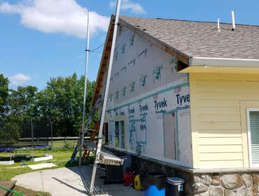 Photos by From the Ground Up #5 Removed vinyl siding and installed Hardiplank concrete fiberboard.