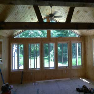 Photos by Hussey Construction Inc #3 Demo existing deck, Build 25x25 room on big foot footings.
Insulate , Electrical, T&G beadboard and trus beams.