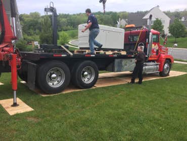 Chuck and Tony unloading gener