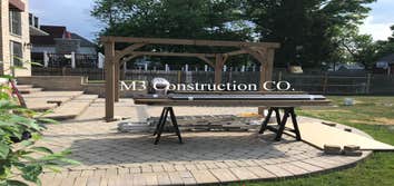 Photos by M3 Construction Co #2 Full Gazebo kit build with concrete footings poured in between brick pavers. Custom tv mount, cieling fan, outlets and 