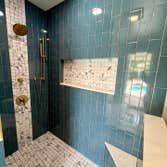 Tiling Work Transforming bathrooms, one tile at a time! ? Loving the fresh look of our latest shower remodel featuring sleek blue Subway tiles. Clean l