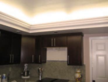 Kitchen Remodel Added crown molding with accent lighting and painting