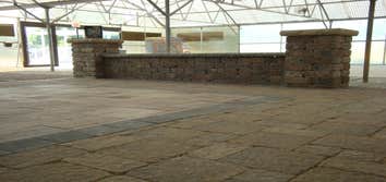 AreA Landscape Supply Inc. - Interior Displays Interior showroom designed with paver patio ideas and vertical focal points as well, such as seat walls 
