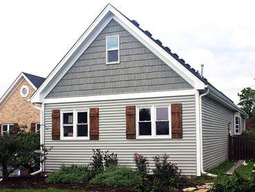 Architectural Shingles This is Owens Corning Tru Definition Architectural Shingles in Onyx Black and Mastic Siding in Scottish Thistle.
