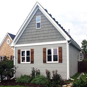 Architectural Shingles This is Owens Corning Tru Definition Architectural Shingles in Onyx Black and Mastic Siding in Scottish Thistle.