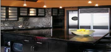 NW Glisan This sleek Pearl District has a kitchen with all the bells and whistles, including a built-in breakfast nook, a pantry with a porthole door a