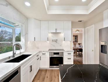 High-End Contrast Kitchen Remodel in El Dorado Hills, CA 95762 This kitchen renovation is a masterclass in elegant, high-contrast design. The space pai