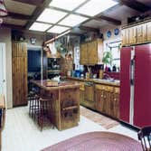 1979: Early American Kitchen Remodel Two existing walls were removed to create a large kitchen area, and an early american theme pulled the look of the