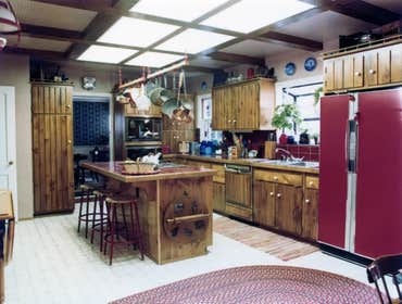 1979: Early American Kitchen Remodel Two existing walls were removed to create a large kitchen area, and an early american theme pulled the look of the