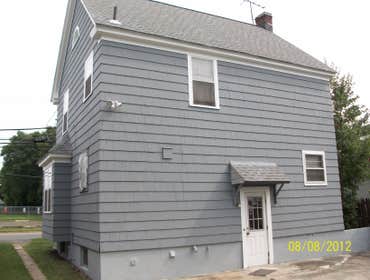 Brilliant Painting, LLC Exterior Project 1 Before and after photos of a full house that has been power washed, scraped, hand sanded, primed, and painte