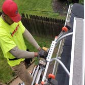 After Cleaning The Gutters Handi Boyz installing Gutter Gloves LeafBlaster Pro Gutter Guards.