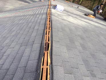 Old roof vent ridge cut out for new vent ridge to be applied