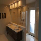 Bathroom Remodeling This homeowner wanted to update their bathroom with a stunning wood and glass feature wall and open-plan design. We installed a Jac