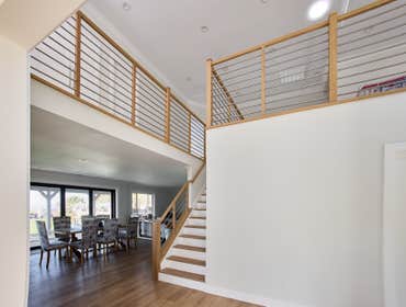 Photos by San Clemente Woodworking #1 Stainless Steel horizontal rods with our custom shadow posts. Clean lines and modern design.