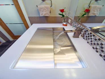 Project photos from Summit Design Remodeling This client wanted the main feature in their bathroom to be a "trough" sink. They also wanted clean and s