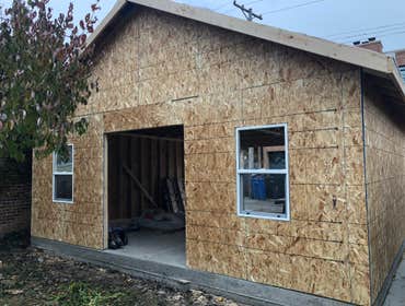 Photos by A-Windy City Garage Corporation #7 New garage construction with Hardie siding and French patio door.