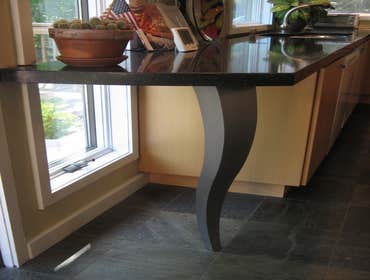 Modern Kitchen Remodel This modern architect's kitchen is a combination of Beech wood, high gloss white, and aluminum & glass. The natural slate floor