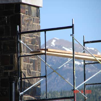 Vlasimsky Random ashlar Dry Stack on Double Sided Custom Designed and Built Smoke-less 45 foot tall Fireplace. Fireplace Designed and Built from the g