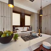 SF Decorators Showcase The dining room sets the stage for luxurious entertaining. Soft hues of smoke and limestone juxtapose with charred black, bronze