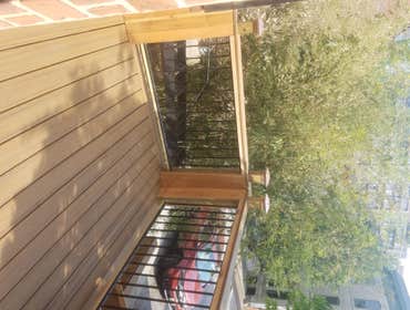 Deck Upgrade Existing structure was not constructed to code and was failing, new pressure treated lumber frame with cedar finish and aluminum rail to c