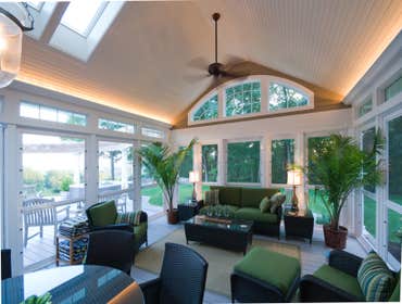 Cumberland Outdoor Living 3-season room, patio, walkways, deck, curved cedar pergola, stone fire pit, landscaping, landscape lighting
