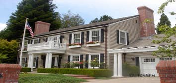 Contra Costa County, CA Exterior Remodel This beautiful Colonial style exterior remodel features a new balcony/entry with columns, intricate spindle ra