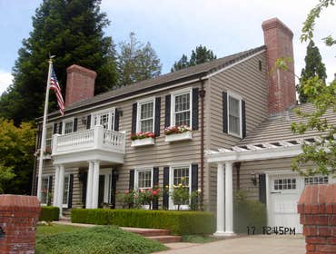 Contra Costa County, CA Exterior Remodel This beautiful Colonial style exterior remodel features a new balcony/entry with columns, intricate spindle ra