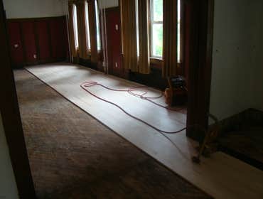 Fraternity Floor We replaced the hardwood flooring throughout the first floor of this fraternity house. There was a lot of damage to the sub floor whi