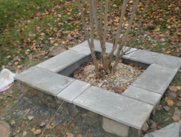 Paver Patio and Walkway This is a a combination of some of our work. Landscaping box and Veneer retaining wall, walkway and flagstone patio.