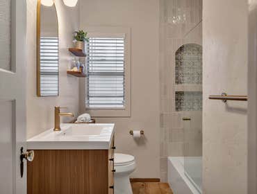 Bathroom Remodel | Redwood City, CA Transforming everyday spaces into elegant retreats. This bath remodel features warm wood tones, custom tilework, mo