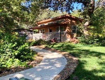 Photos by D. Michael Designs #5 500 square foot Guest Home with exterior front porch. Has two mini split HVAC units, full kitchen, living room. bedroom