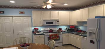 Kitchen In this kitchen I installed 4 recessed lights, a ceiling fan, and under cabinet lights.