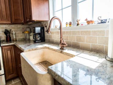 Timeless Kitchen Updated this kitchen for our clients with all the bells and whistles, including the kitchen sink!